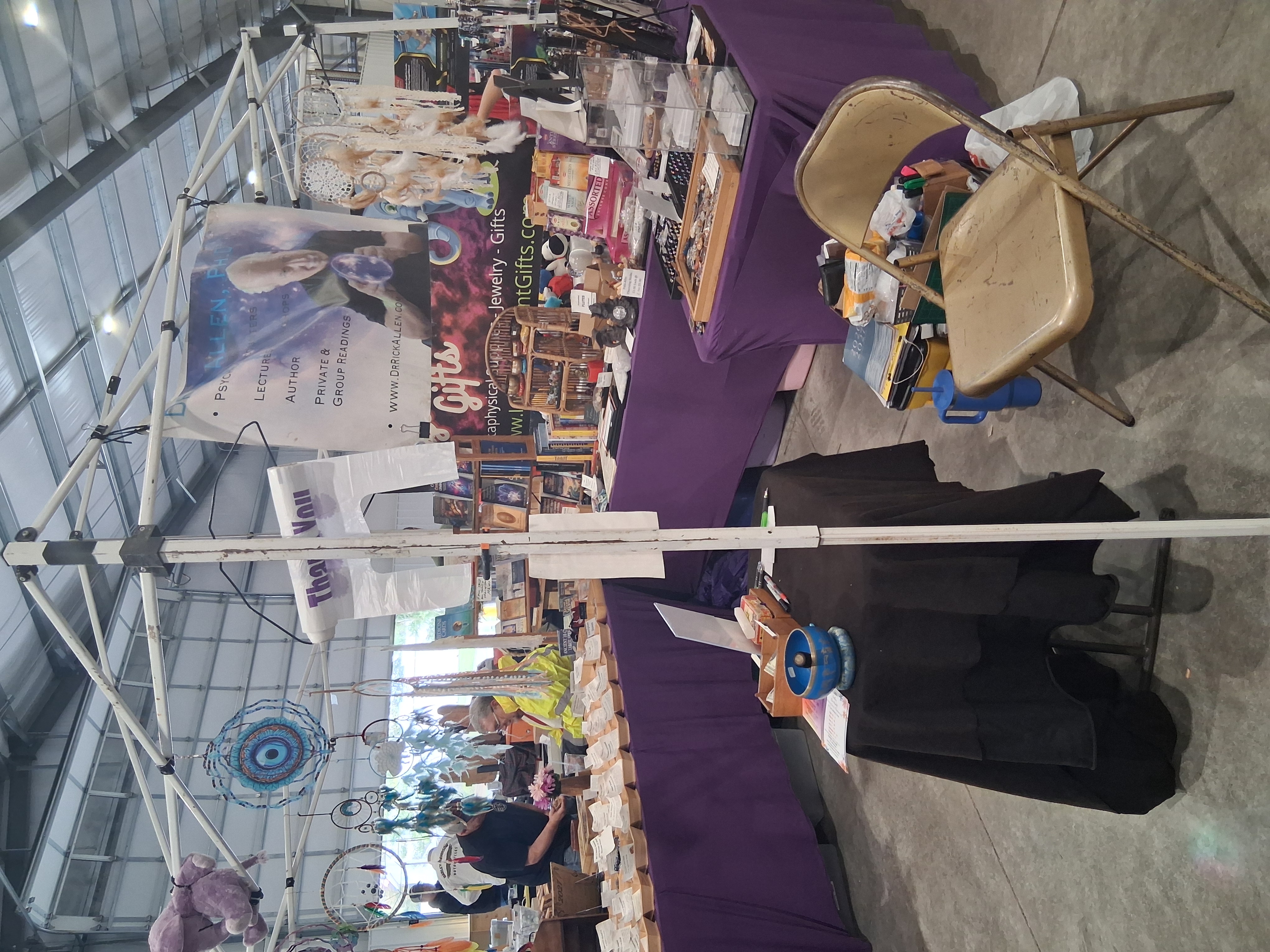 Full vendor booth showing compact Solar Reading table